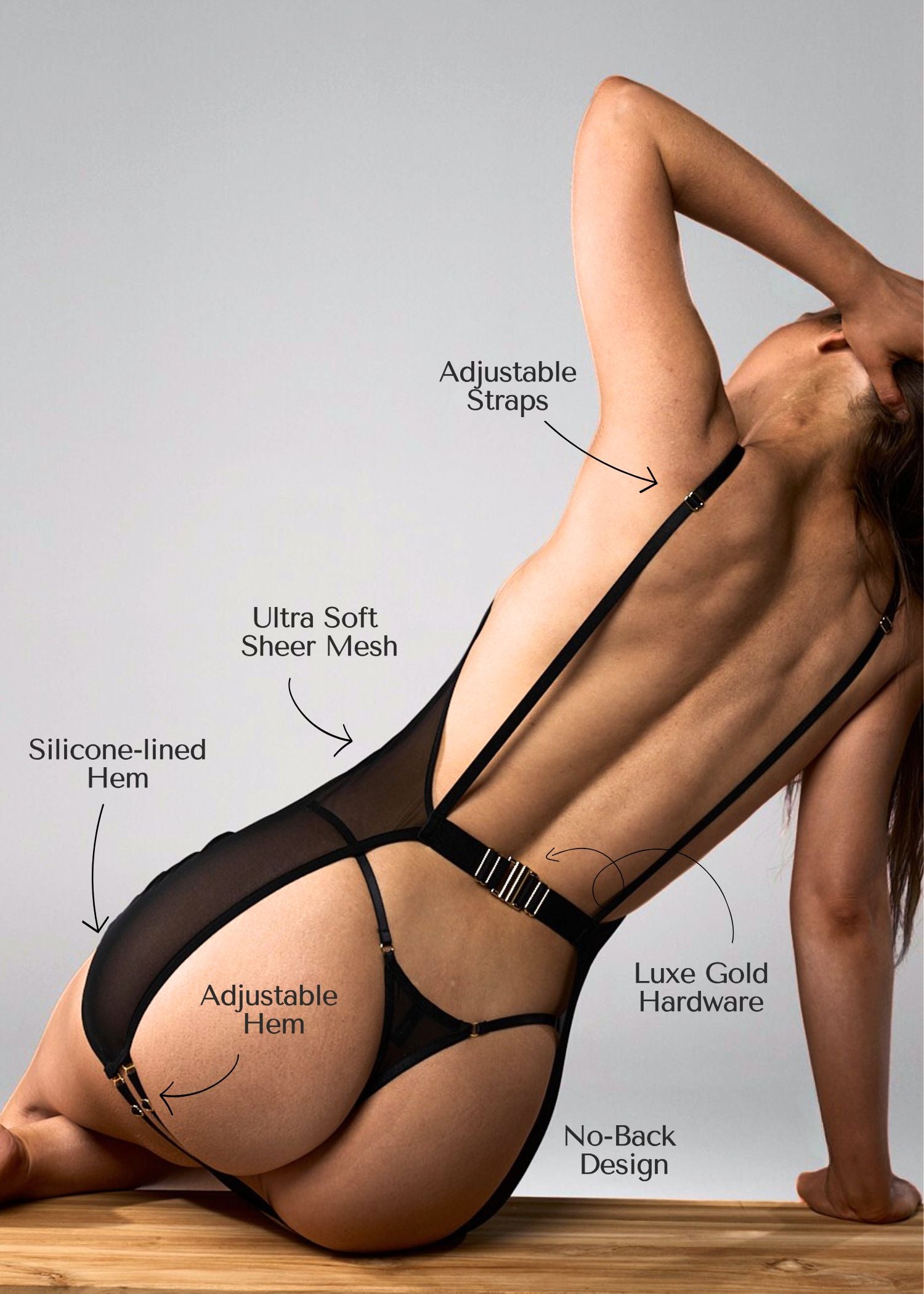 Black lingerie dress with labeled features on a neutral background